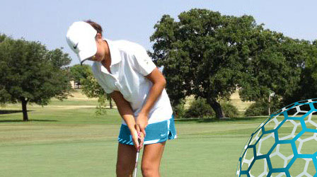 Junior golfer taking a lesson as part of the MB 360 Legends Golf Program.